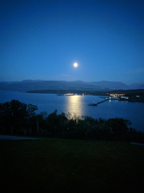 Full moon glistening in the Menai Strait beside Bangor Pier